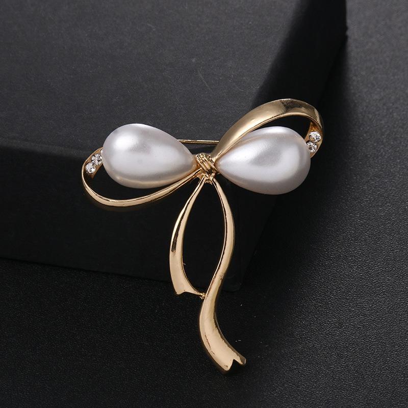 New temperament pearl bow brooch alloy diamond-encrusted brooch anti-light multi-functional large pin