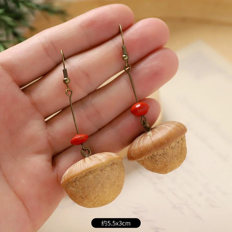 Retro handgefertigte Pflanzenfrucht-Ohrringe Mori Tannenzapfen literarischer und ethnischer Stil traditionelle chinesische Medizin Trockenfrucht Nische kreative Ohrringe Frauen