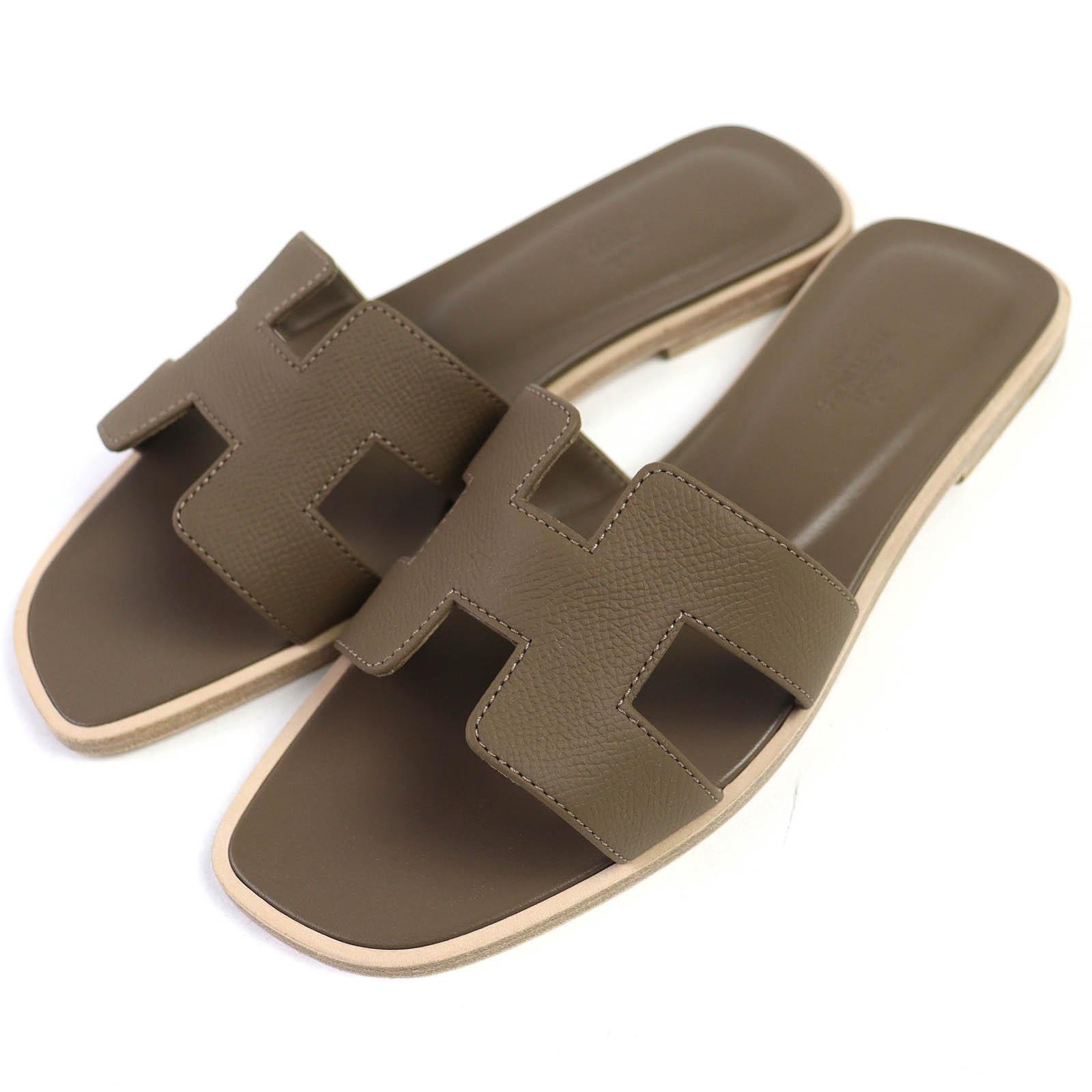 

Бездоганні шкіряні плоскі сандалі HERMES Mule Oran з логотипом H шкіряні Жіночі 37 Вживані