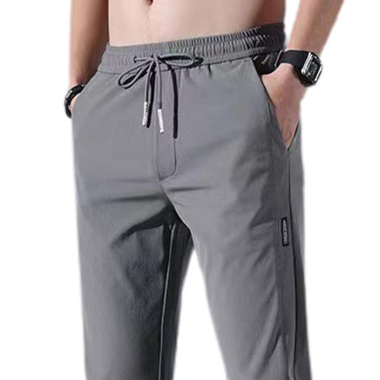 Men Pants Solid Color Drawstring Mid Waist Pockets Loose Streetwear Straight Working Trousers for Daily Wear