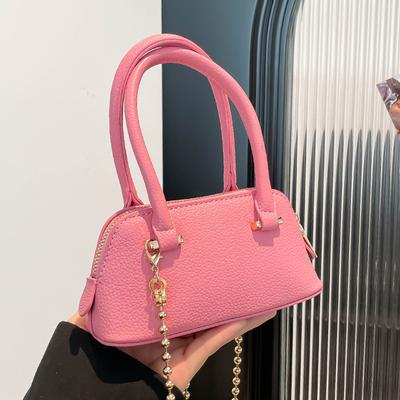 Versão coreana de bolsa de mão de concha de cor sólida simples casual de alta qualidade, tendência de nicho, bolsa mensageira versátil com corrente para o dia a dia, feminina