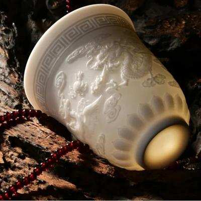 White Jade Embossed Ceramic Dragon and Phoenix Tea Cup Master Kung Fu Tea Set Tea Tasting Cup Household White Porcelain Cup