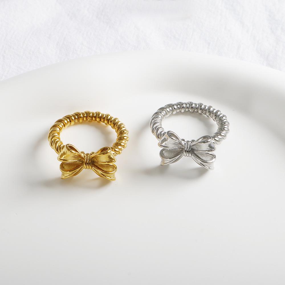 

Korean Fashion Geometric Bow Twist Titanium Steel Gold-Plated Ring Size 7