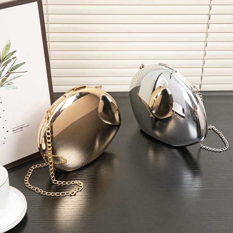 2025 Glänzendes Gold Metallic Gänseei Acryl Clutch