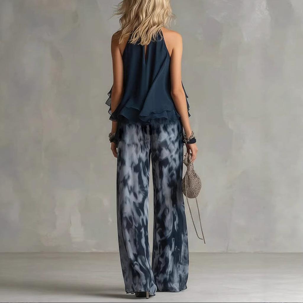 Completo due pezzi con top senza maniche con scollo all'americana, dettaglio a balze e pantaloni a gamba larga sfumati