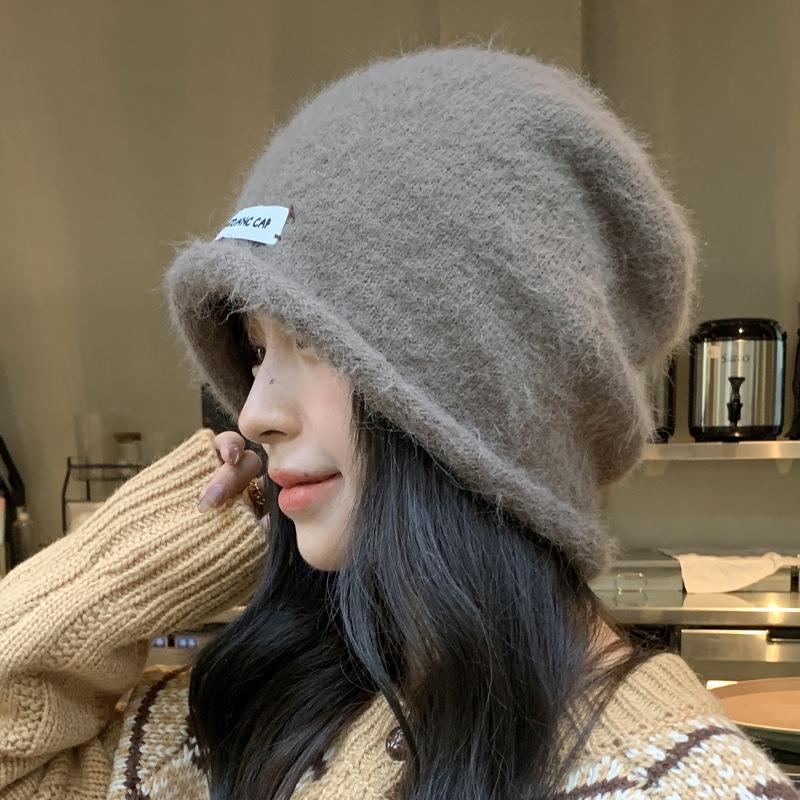 Herbst und Winter neue Stapelmützen Kinder lockeres Gesicht kleine Baotou-Mütze Ohrenschützer kalte Mütze flauschige warme Überziehmütze
