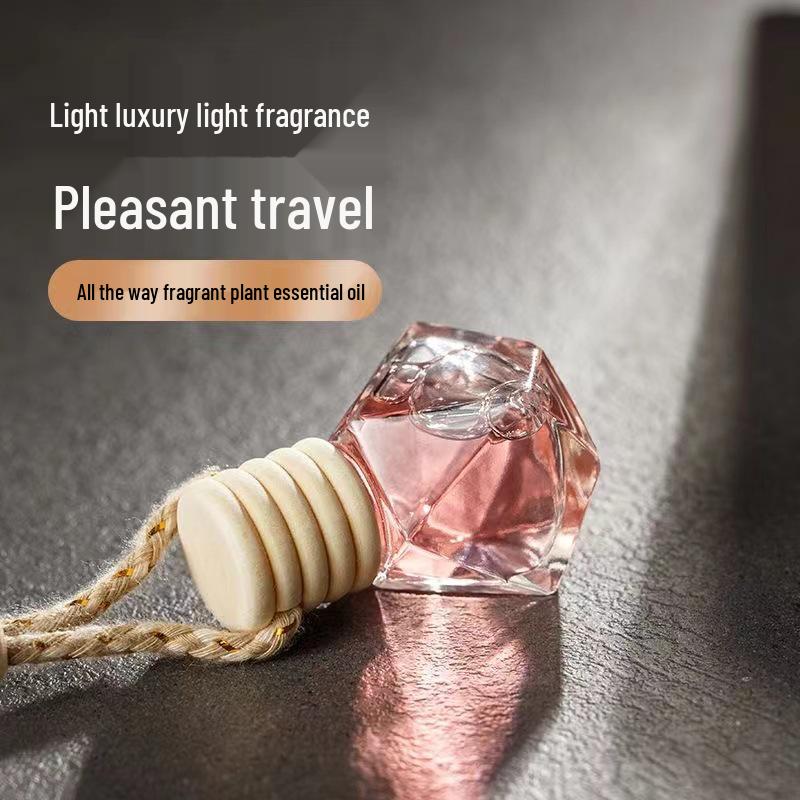 Car Interior Perfume Hanging Ornament - Long-Lasting Air Freshener & Aroma Diffuser for Rearview Mirror.