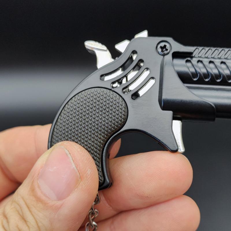 1Pcs Mini Keychain Metal Rubber Band Gun Game Toy Gun Launcher საბავშვო სიმულაციური პისტოლეტი სათამაშოები საჩუქრები საკიდი