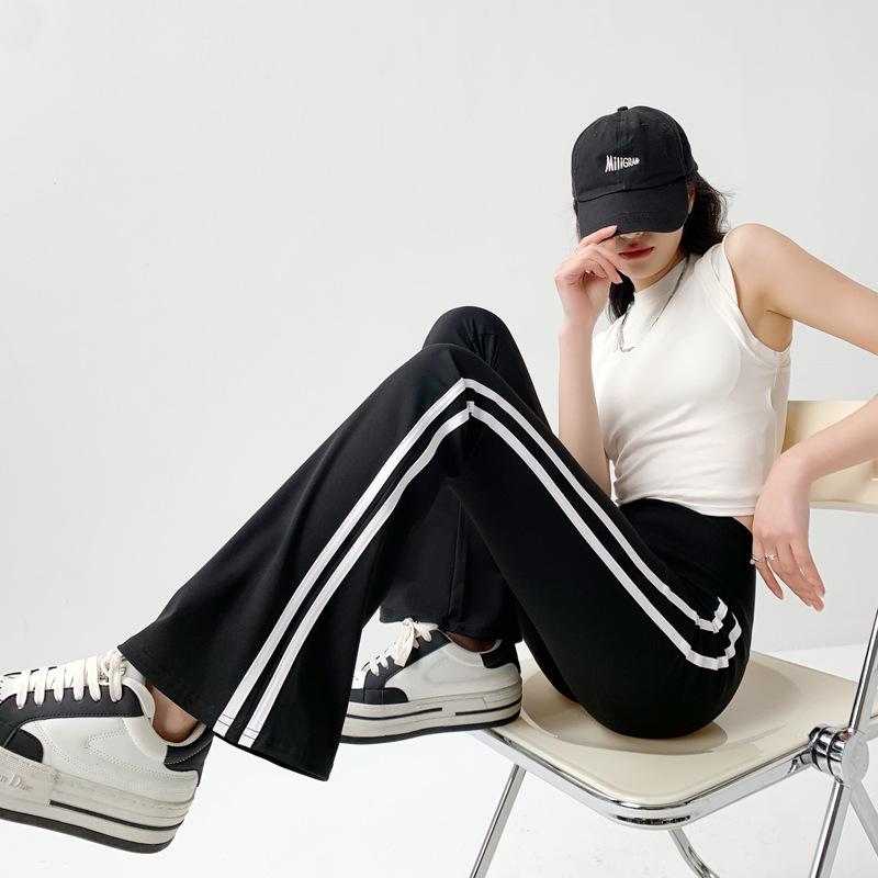 Schwarze Schlaghose mit Streifen und hoher Taille für Damen mit Taschen – schmale Passform, locker, modisch für Frühling und Herbst.