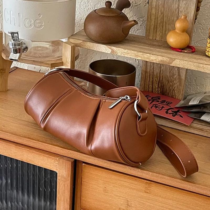 Retro cylindrical shoulder bag for women  crossbody bag  versatile cushion  solid color  high quality  niche  casual  new
