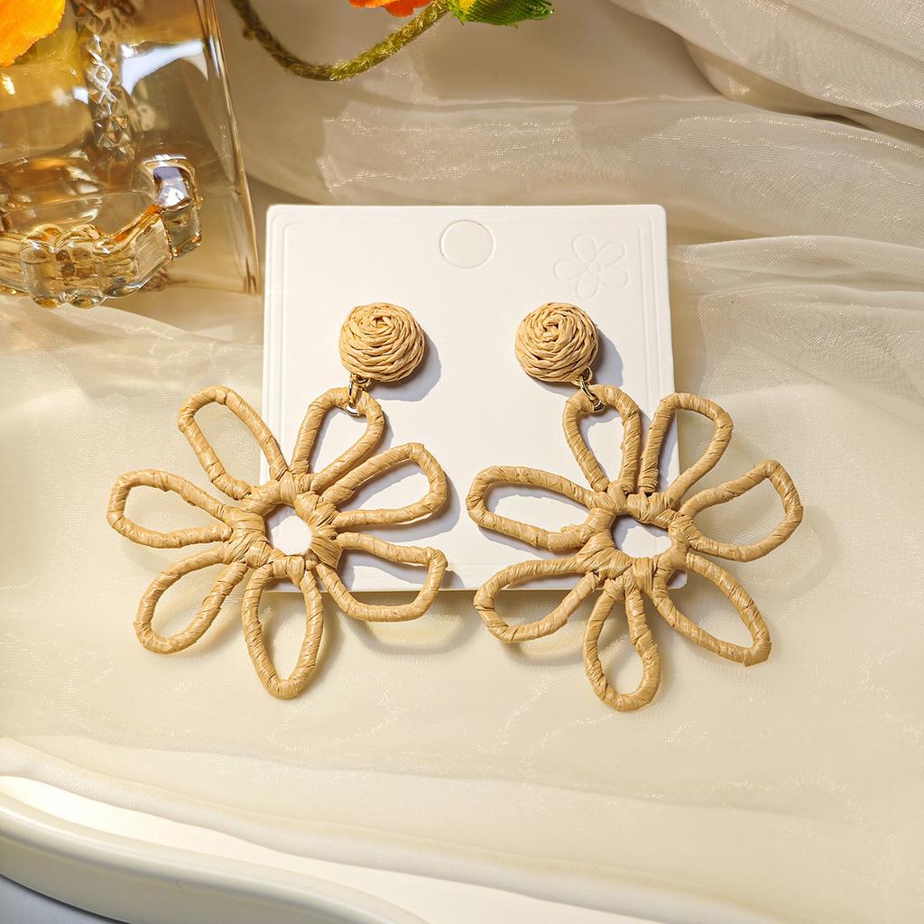 European and American cross-border summer vacation style earrings women, personalized color hand-woven raffia hollow flower earrings