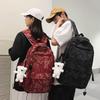 The new bear graffiti backpack has a large capacity of foreign style tide and a couple of middle and high school students have a class backpack tide.