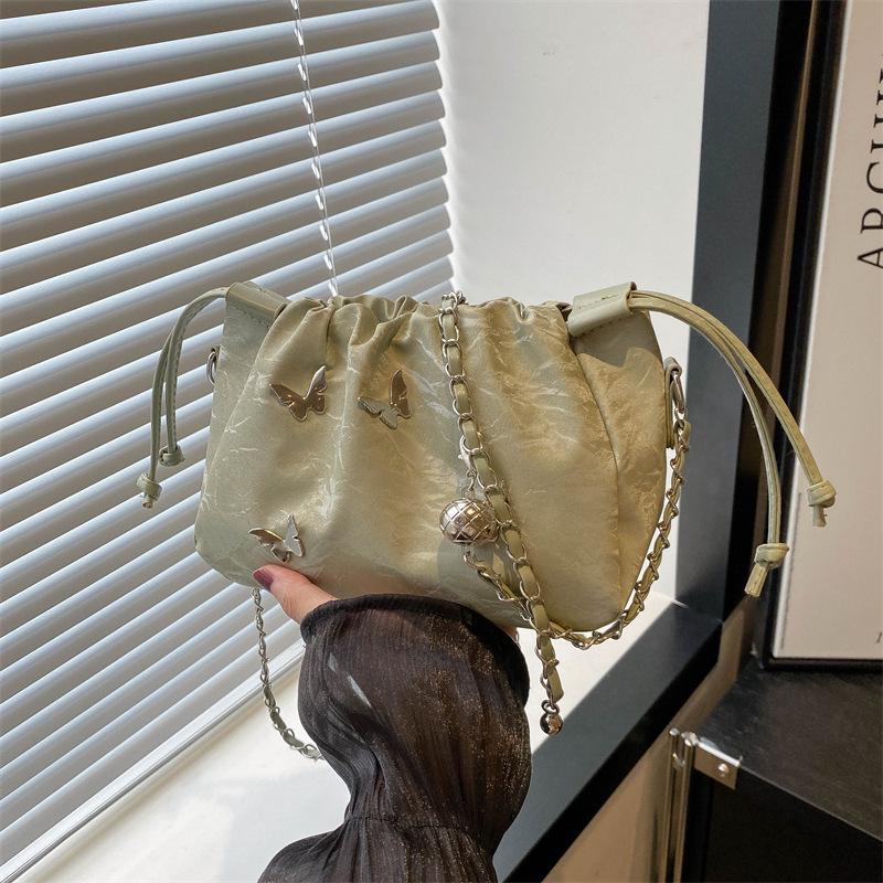 High-End Women's Metallic Bow Bucket Bag - Autumn 2024 Niche Fashion Drawstring Style