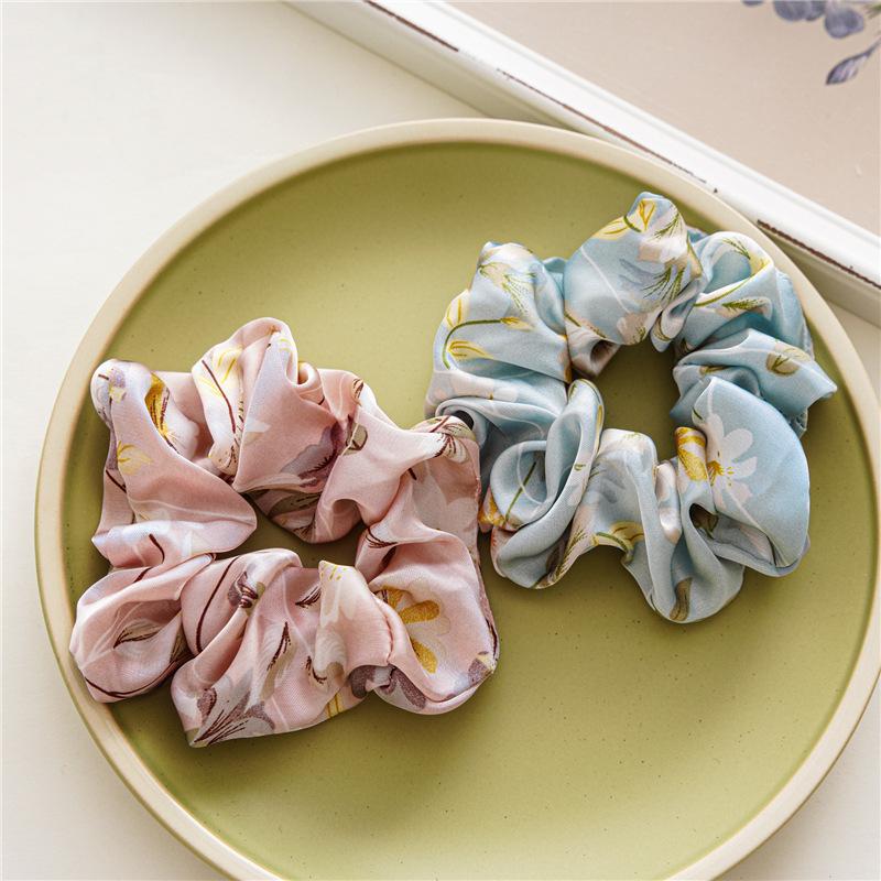 French-style smooth satin scrunchie with floral pattern, versatile elastic hair tie for women, popular on Instagram