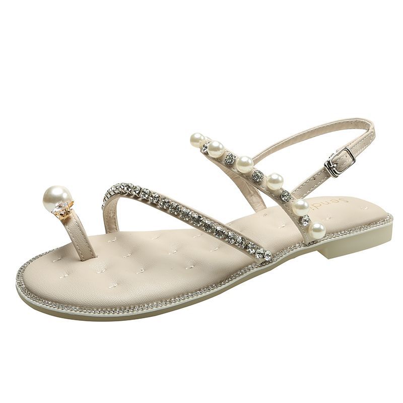 

Rhinestone pearl set toe flat sandals female summer 2025 new Korean version temperament fairy wind one-word buckle beach slippers 40 абрикосовый