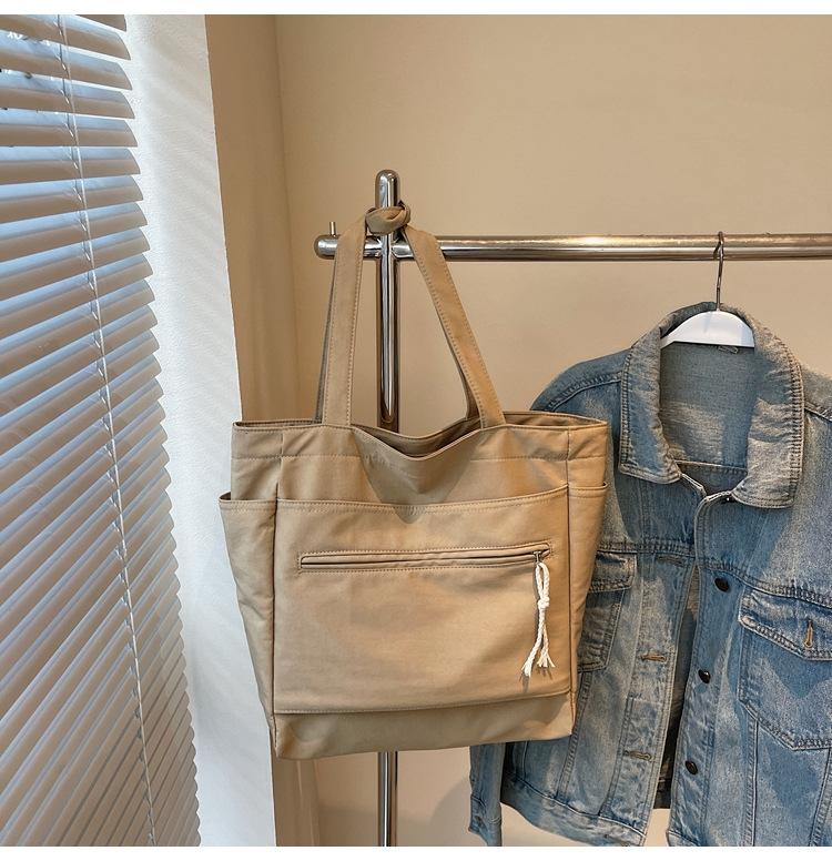 

2025 new canvas bag women s large-capacity casual versatile simple shoulder bag spring and summer college student tote bag 40*12*33 хаки