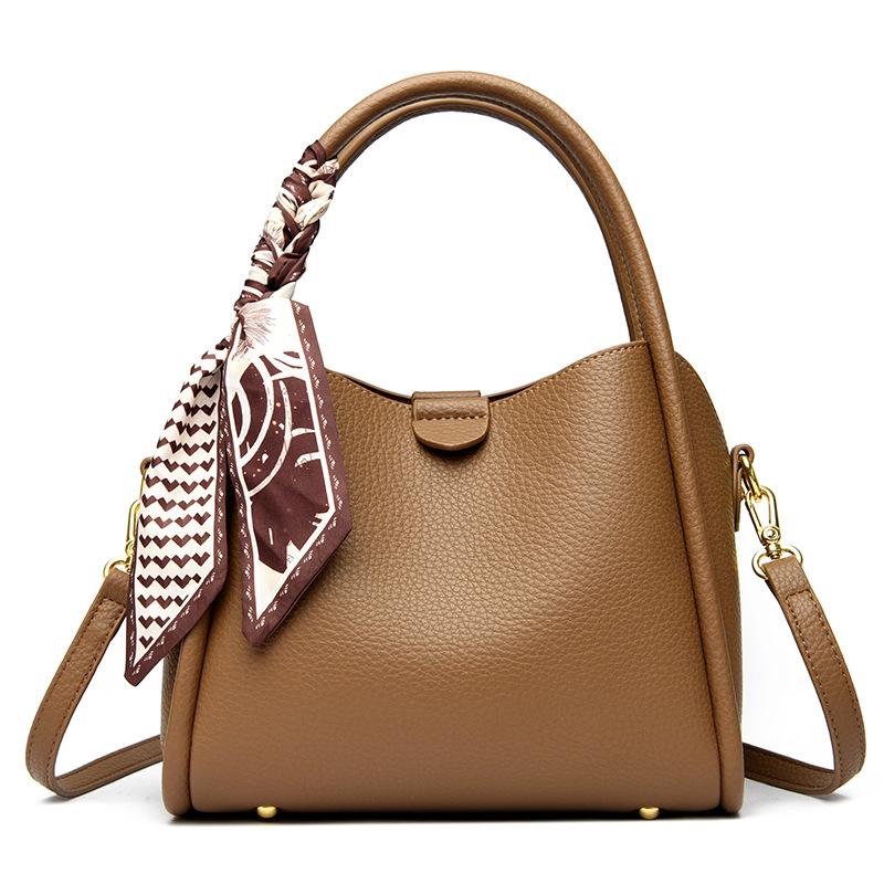This Bucket Bag Is A Simple and Fashionable Urban Design with A Lychee Pattern and A Silk Scarf. It Is A Hand-held Shoulder Bag