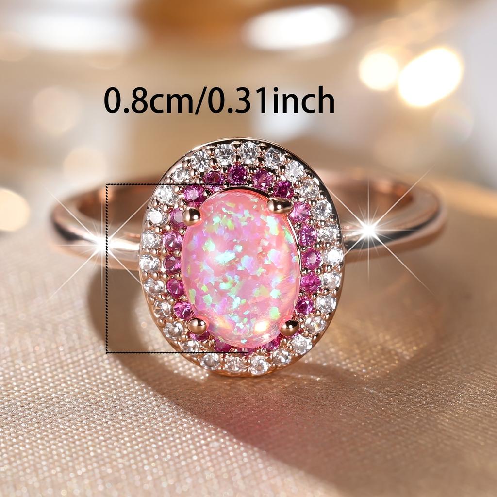 A piece of jewelry inlaid with oval-shaped pink synthetic opal, simple, elegant, classic, exquisite, fashionable, luxurious, unique, versatile, and