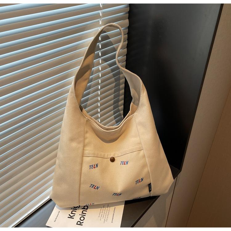 Canvas bag Women's shoulder bag Large capacity commuter tote bag Versatile student armpit bag