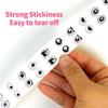 Roll of 500 Small Emoticon Wavy Eyes Stickers for Journaling, Decoration, and Envelope Sealing.