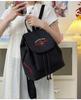 Japanese Student Casual Backpack with Embroidered Puppy Design, Drawstring Closure, and Matching Small Bag for Daily Use.