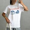 Le Weekend Graphic TShirt Womens Short Sleeve Crew Neck Casual Top Coffee Croissant Print with Orange Lettering Printed Tee