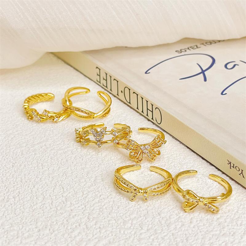 Mittelalterlicher Stil Gold Retro Schleife Hohlöffnung Ring Licht Luxus High Sense Nische Design Zeigefingerring