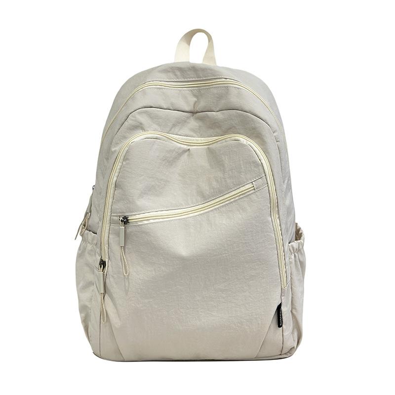 Schoolbag casual large-capacity backpack girls Korean version solid color simple college student schoolbag high value light casual backpack