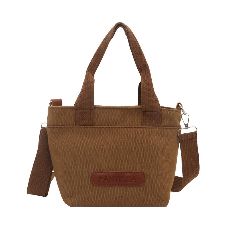 

Handheld small cloth bag women s new niche casual simple canvas bag commuter shoulder messenger bag коричневий