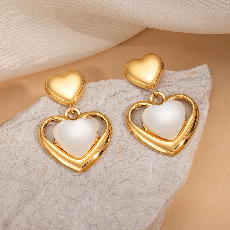 European & American Titanium Heart Cat's Eye Earrings - Hollow Exaggerated Design, Versatile and Exquisite Women's Jewelry