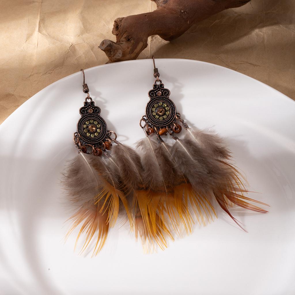 Retro ethnic style woven feathers long fringed earrings, bohemian high-end hollow rice bead earrings