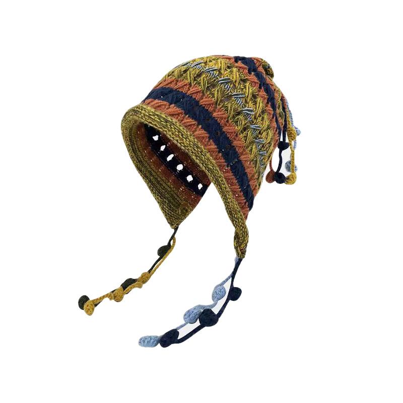 Handmade women's knitted headgear autumn and winter color fringed ball lace-up ear protector hollow knitted wool cap