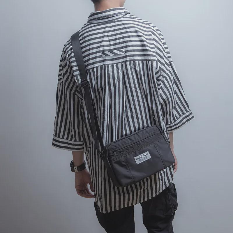 Herren Oxford Stoff Lässige Messenger Umhängetasche: Neuer Trend in der amerikanischen Street Fashion.