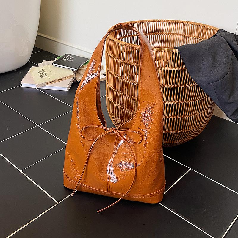 New oil wax leather women's bag tote bag niche design bow lazy loose shoulder armpit bag