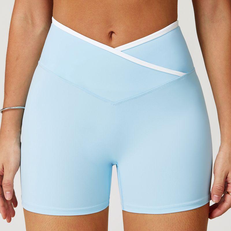 

Guangzhou Zechuang Clothing Co., Ltd. Cross High Waist Yoga Shorts Tight Nude Feel Peach Hip Lifting Sport Short Water wave blue XL