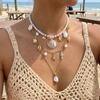 Bohemian Handgefertigter Seestern Sonne Anhänger Halskette für Damen Sommer Muschel Imitation Perle Reiskorn Perlen Choker Strandurlaub Schmuck