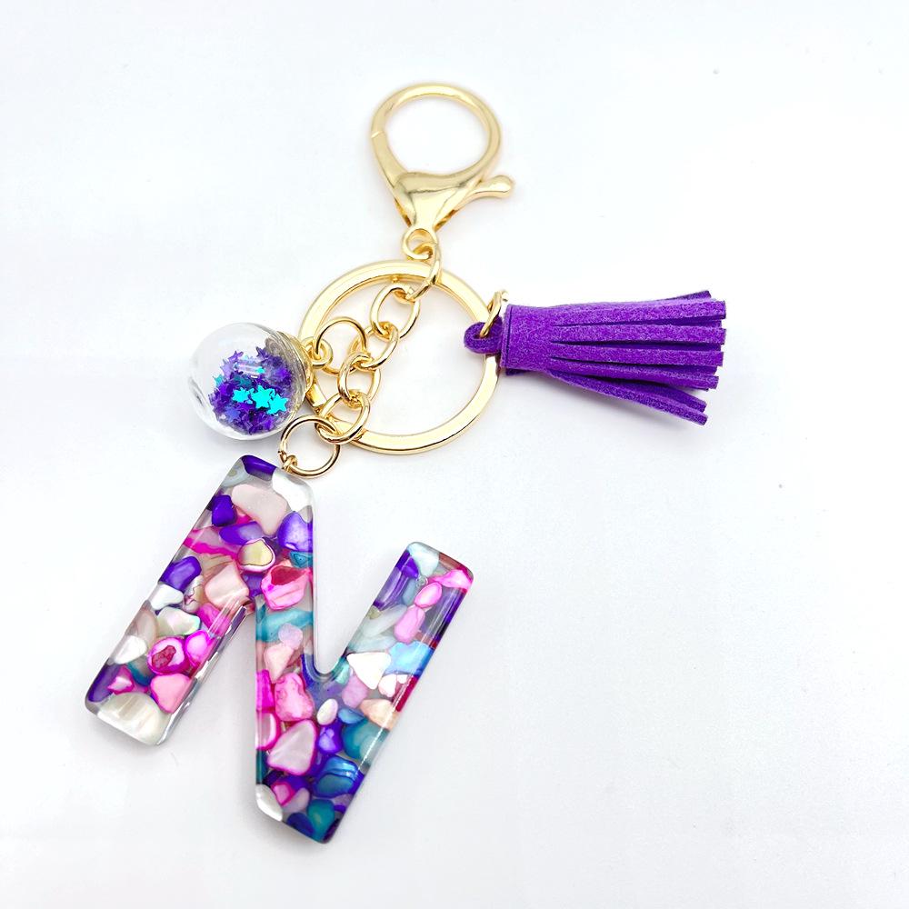 Breloc inițial englezesc de vânzare la cald european și american cu accesoriu cu ciucuri violet