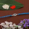 Estele Rhodium Plated Auspicious Evil Eye Rakhi with Austrian Crystals and Fancy Silk Thread