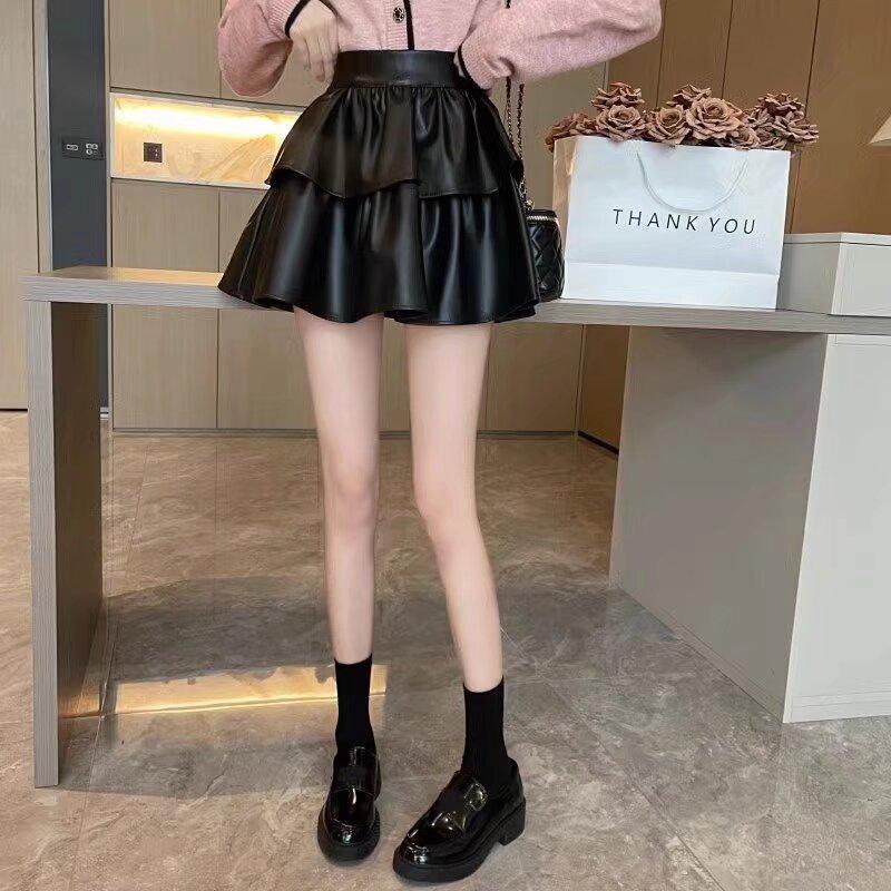 Dámská kožená midi sukně s vysokým pasem a plisováním, nadměrná velikost: Nadývaná, zeštíhlující jarní/podzimní dortová sukně proti odhalení