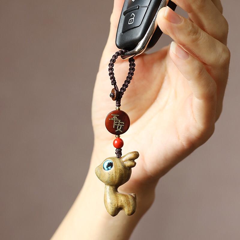 

Брелок для ключей в виде милого оленя из сандалового дерева с плетеной веревкой для мужчин и женщин