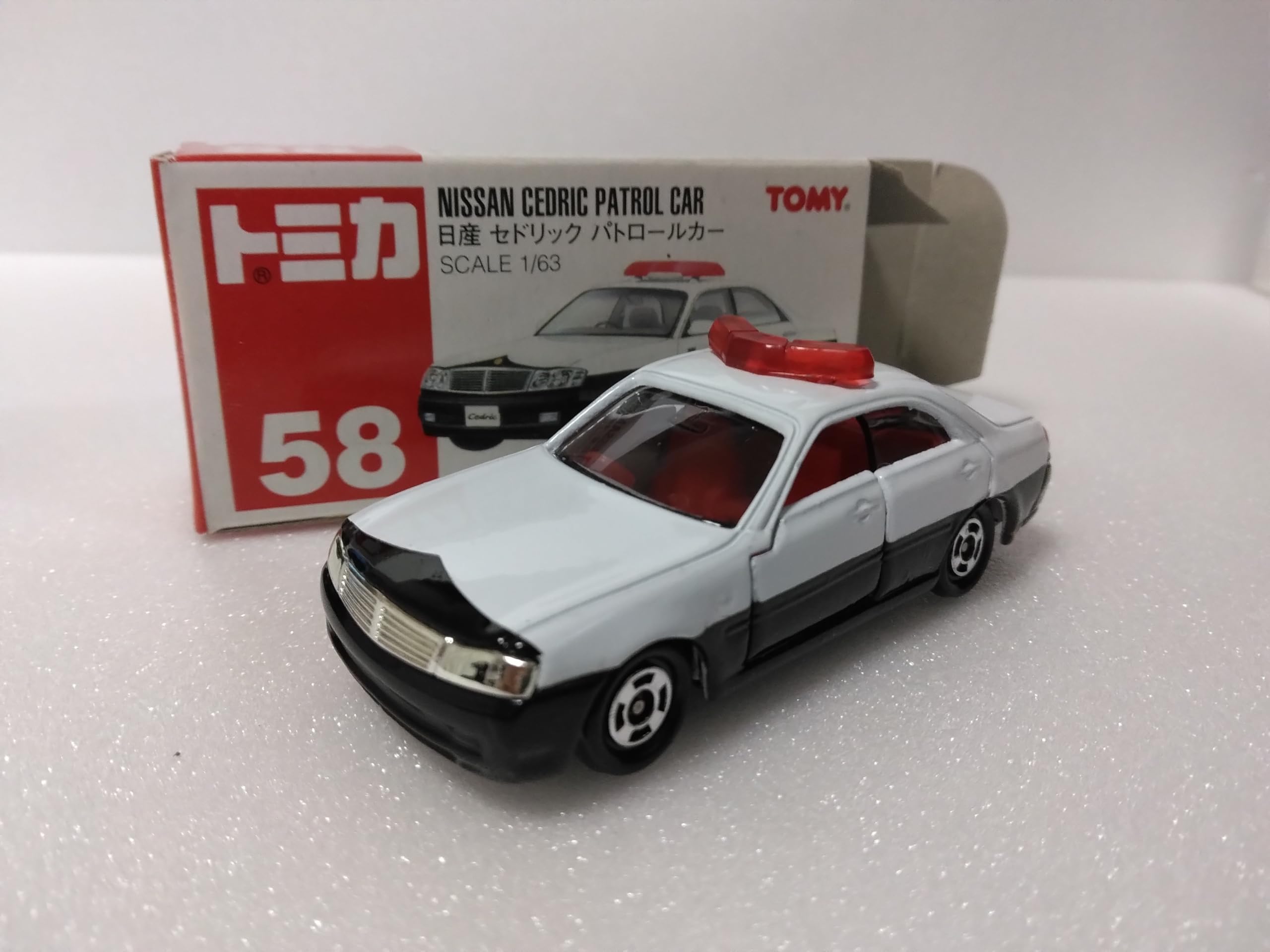 

Tomica Nissan Cedric Patrol масштаб №58 Автомобиль, 1/63 белый