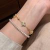 Xiaohongshu Golden Crushed Ice Laser Four-Leaf Clover Bracelet - Vintage Luxurious Stackable Hand Jewelry