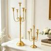 Iron Candelabra Tapers Candle Holders Candlestick Centerpieces with Five Candle Positions, a Golden Finish, and Formal Dinner or Ceremony Table