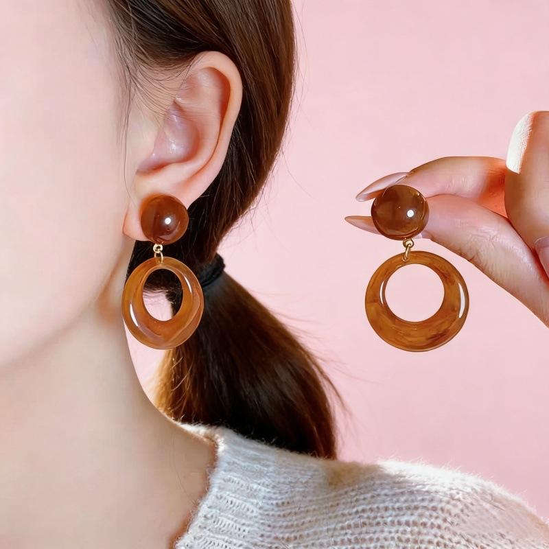Maillard style coffee color round hollow earrings women s high-end stud earrings fashion personality versatile simple earrings wholesale