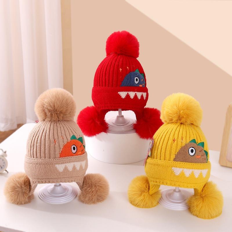 A children's dinosaur wool hat winter new cartoon jacquard knitted hat medium and older boys and girls ear hats
