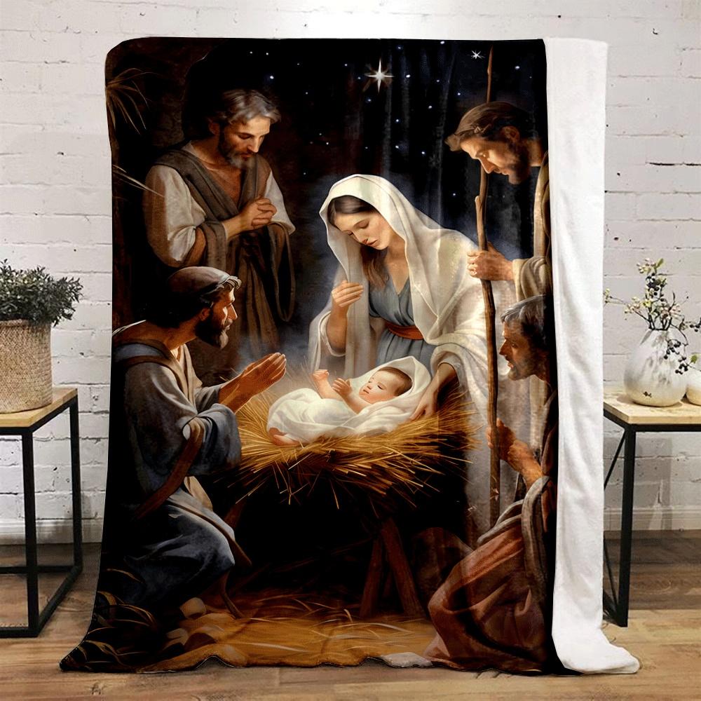 A radiant newborn in a manger surrounded by figures under a glowing sky. for all seasons blanket lunch break throw gift
