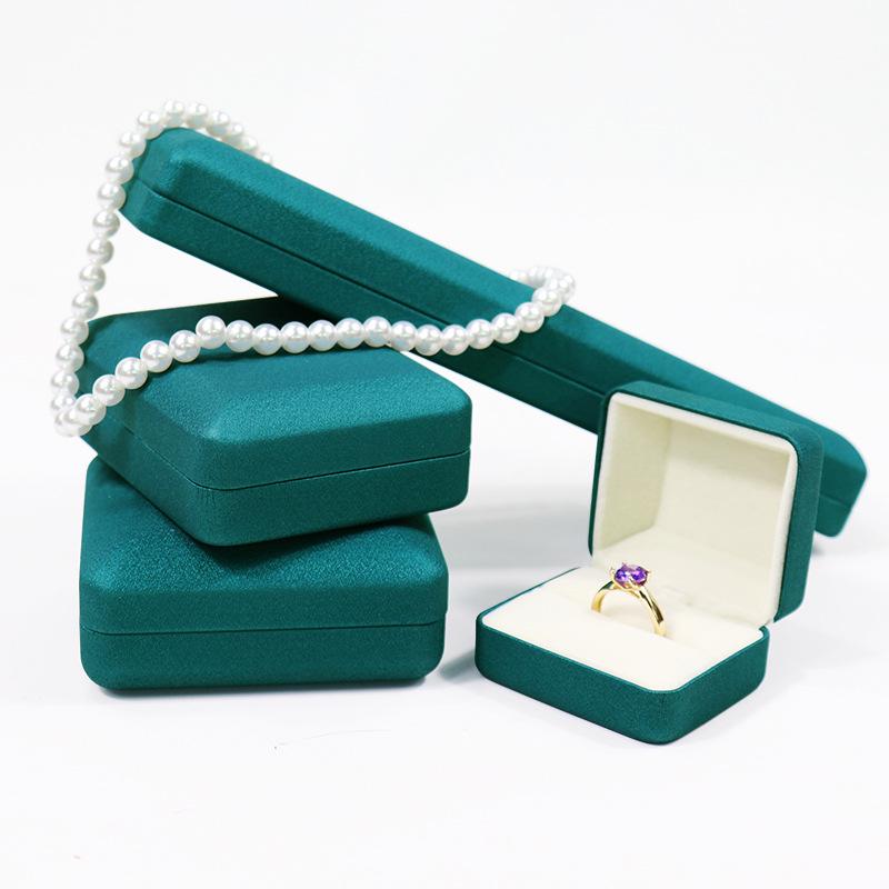 Kulatý roh PU kožená šperkovnice na prsteny, náhrdelníky a náramky