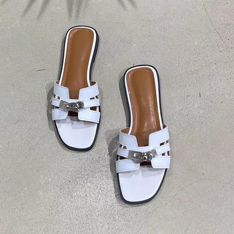 

Sheepskin version~ high-end small gold buckle leather one-word slippers women s summer outer wear hollow soft bottom half slippers small sandals 40