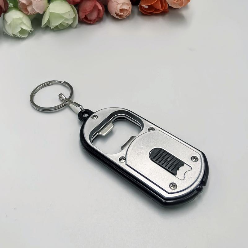 Ouvre-bouteille LED Multifonctionnel Mini Lampe de Poche Illuminée Porte-clés Pendentif