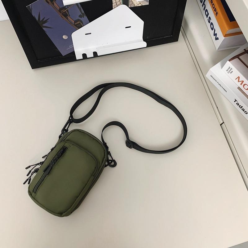 Mobile phone bag female messenger 2025 new mini small bag canvas bag fashion casual vertical shoulder key change